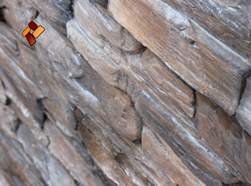Облицовка деревянного дома декоративным искусственным камнем